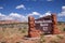 Traditional red rocks sign at the entrance of the Kodachrome Basin State Park