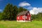 Traditional red Swedish house at the forest