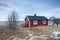 Traditional red wooden houses on the shore of Reine fjord. Beautiful winter scene of Vestvagoy island. Picturesque morning view