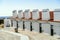 Traditional residential terraced houses with huge chimneys next to castle in Campo Maior, Alentejo, Portugal