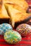 Traditional romanian easter bread pasca with cheese and raisins and nicely decorated easter eggs orthodox tradition