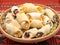 Traditional romanian festive dessert dumplings filled with assorted turkish delight served on a traditional cloth
