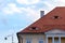 Traditional roof with small windows like eyes in Sibiu, Transylvania, Romania. Detailed architecture of a house top with columns