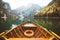 Traditional rowing boat at Lago di Braies in the Dolomites