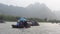 Traditional Rowing Boats Between Karst Mountains