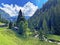 Traditional rural architecture and family livestock farms on pastures in the Giessbach Nature Park and the mountain range Bernese