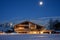 Traditional rural wooden house at moonlight