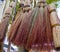 Traditional Russian brooms hang over the market counter