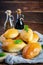 Traditional Russian cabbage pies on wooden background. Baked homemade pirozhki with cabbage