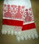 Traditional russian folk handmade red thread embroidery at natural white linen