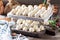 Traditional Russian handmade dumplings frozen on the board. Russian pelmeni