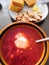 Traditional Russian red borscht on a plate.