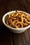 Traditional russian small bagels in ceramic bowl on dark rustic table