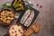 Traditional Russian snacks and vodka, sauerkraut with cranberries, herring, pickled cucumbers, pickled mushrooms and rye bread on