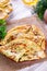 Traditional Russian thin pancakes or crepes with cheese, herbs on a plate