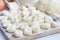 Traditional russian, ukrainian cottage cheese & x22;lazy& x22; dumplings, raw dumplings on wooden board, horizontal