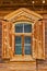 Traditional russian wooden window with open shatters