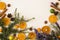 Traditional rustic Christmas background with Mediterranean theme: cinnamon sticks, pine cone, star anise, dry oranges, blooming R