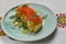 Traditional salmon puff pastry with fresh grapes. Delicious recipe. Served on a plate over traditional tablecloth