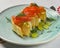 Traditional salmon puff pastry with fresh grapes. Delicious recipe. Served on a plate over traditional tablecloth