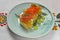 Traditional salmon puff pastry with fresh grapes. Delicious recipe. Served on a plate over traditional tablecloth