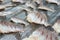 Traditional salted fish drying on grille