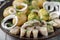 Traditional scandinavian food: salted herring slices with boiled potatoes and fresh  onions