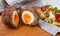 Traditional scotch eggs on a wooden plate. Scotch eggs