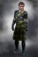 Traditional Scottish Romantic Highland Warrior dressed in green tartan kilt with leather armor / armour