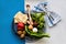 Traditional Seder Plate with symbolic foods on blue and white surface.