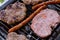 Traditional serbian barbecue rostilj  homemade sausages and burgers. Preparing a barbecue on a grill, outdoor roasting meat. Tra