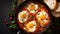 Traditional shakshuka with eggs, tomato and parsley in a iron pan. Top view with copy space. Israeli food