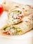 Traditional shawarma with chicken. Roll in a wheat tortilla with vegetables, salad and chicken. Turkish food. Vertical shot