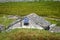 Traditional sheepfold with a solar panel in French alps mountains