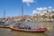 Traditional ship carrying port wine barrels in Porto