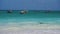 Traditional show sailboats on amazing turquoise water in the Indian ocean at Stormy Weather in Nungwi, Zanzibar