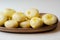 Traditional Silesian dumplings with a hole,  homemade noodles served with butter