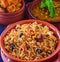 Traditional Sindhi meal-bhugge chawal fried potatoes and sai bhaji