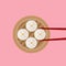 Traditional Siopao steamed buns with red chopsticks on pink background