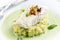 Traditional skrei cod fish filet mashed potatoes in basil champagne foam on a classic plate