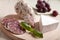 Traditional sliced salami with brie, grapes, basil