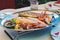 Traditional slovenian cuisine, mixed grilled fish and seafood with garlic oil. Selective focus