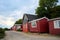 a traditional small,red,danish framehouse in summer in Bornholm with blue sky