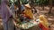 Traditional snack seller, in an old fashioned market, without using plastic wrap