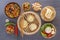 Traditional snacks of Chinese cuisine dim sum - dumplings, spicy salads, vegetables, noodles, steam bread