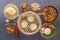 Traditional snacks of Chinese cuisine dim sum - dumplings, spicy salads, vegetables, noodles, steam bread