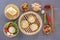 Traditional snacks of Chinese cuisine dim sum - dumplings, spicy salads, vegetables, sauce, steam bread