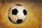 Traditional soccer ball on grunge textured background