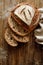 Traditional sourdough loaf of bread baked in a craft bakery on a wooden background