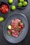 Traditional South American barbecue wagyu roast beef sliced with pico de gallo and salsa verde garnished in a modern design plate